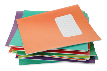 Stack of colorful copybooks isolated on white