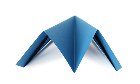 One handmade light blue paper plane isolated on whiteの写真素材