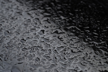 Water drops on grey glass surface, closeupの写真素材