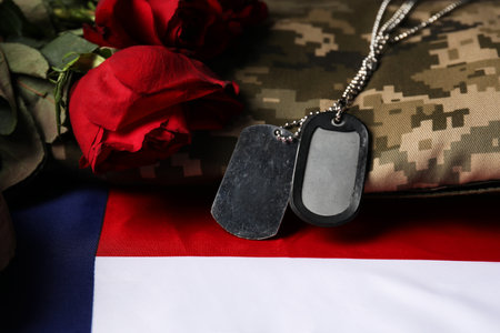 Veterans day. Army tokens, American flag, roses and military uniform, closeupの写真素材