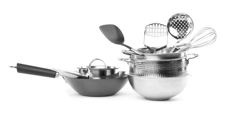 Dishware and cooking utensils isolated on whiteの写真素材