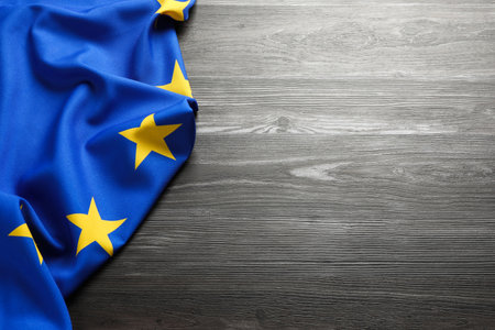 Flag of European Union on wooden background. Space for text