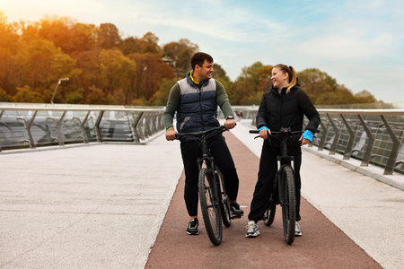 Two people with bicycles spending time together outdoors
