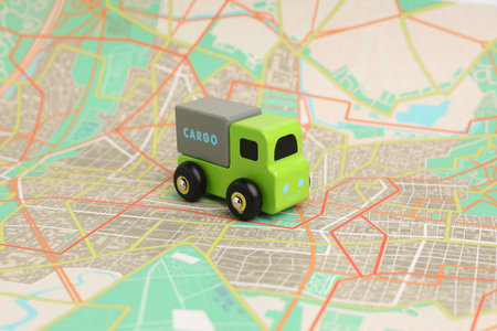 Toy truck on city map. Logistics conceptの写真素材