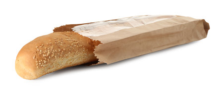 Fresh baguette with sesame in paper bag isolated on whiteの写真素材