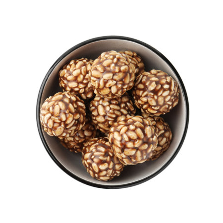 Delicious chocolate puffed rice balls in bowl isolated on white, top viewの写真素材