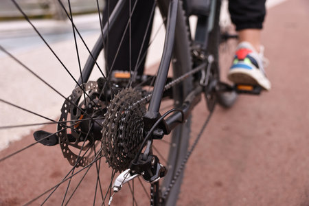 Woman with bicycle outdoors, closeup. Healthy lifestyle