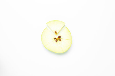 Pieces of fresh apple on white background, top viewの写真素材