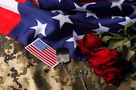 Veterans day. USA army patch, token, American flag, roses and military uniform, closeupの写真素材