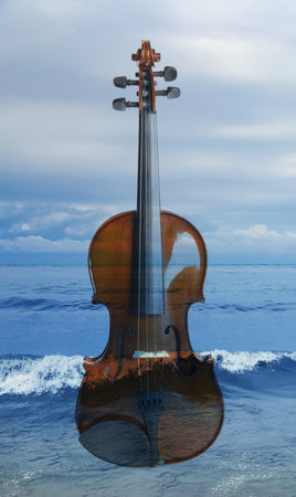 Violin and beautiful seascape, double exposure. Inspiring or relaxing power of musicの写真素材