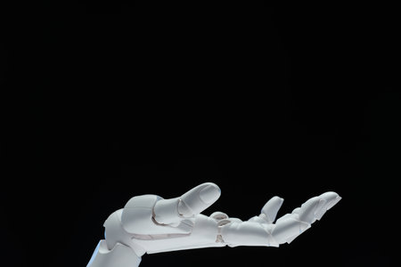Artificial intelligence. Robot hand gesturing on black background, space for textの写真素材