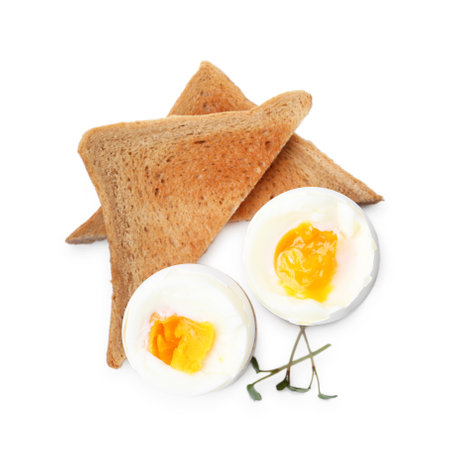 Soft boiled eggs and bread isolated on white, top viewの写真素材