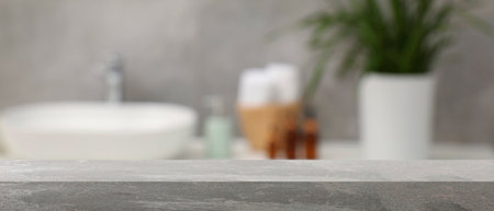 Empty table in bathroom, blurred background. Space for designの写真素材