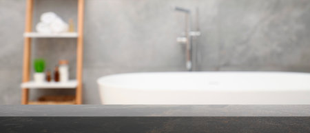 Empty table in bathroom, blurred background. Space for designの写真素材