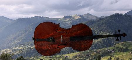 Violoncello and beautiful mountain landscape, double exposure. Inspiring or relaxing power of music. Banner designの写真素材