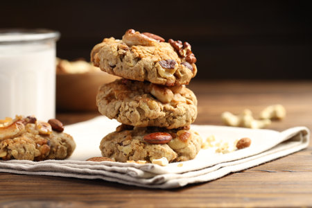 Tasty cookies with nuts on wooden table, closeupの写真素材