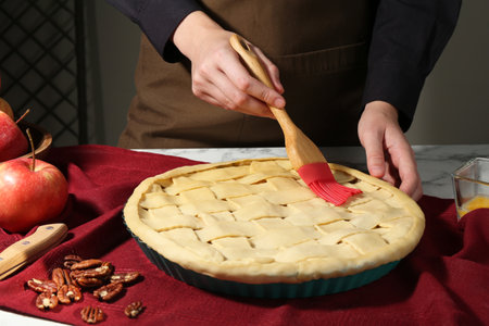 Making homemade apple pie at marble table, closeupの写真素材