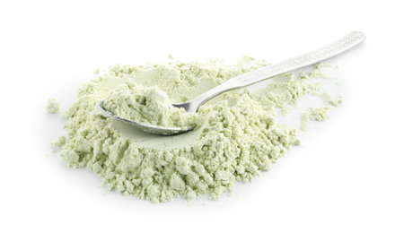 Spoon and dry wasabi powder isolated on whiteの写真素材