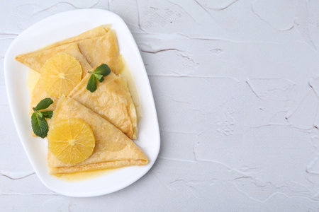 Delicious Crepes on white textured table, top viewの写真素材