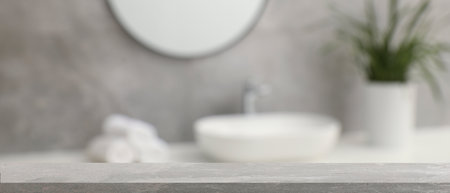 Empty table in bathroom, blurred background. Space for designの写真素材
