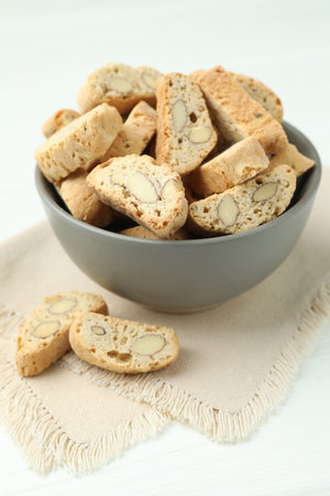 Traditional Italian almond biscuits (Cantucci) in bowl on white table, closeupの写真素材