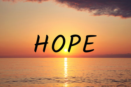 Hope. Picturesque view of beautiful sky over sea at sunrise