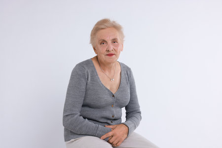 Portrait of senior woman on white backgroundの写真素材