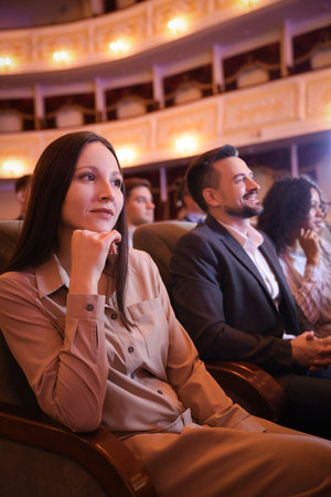 Group of people watching theatrical performance in theatreの写真素材