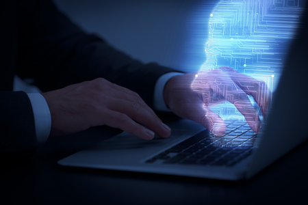Businessman working on laptop at desk, closeup. Digital head coming out of computer symbolizing...
