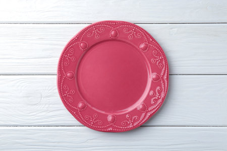 Stylish plate on white wooden table, top viewの写真素材