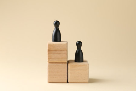Competition concept. Human figures on wooden cubes against beige background