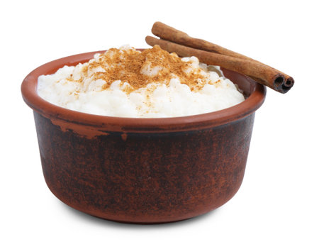 Delicious rice pudding with cinnamon isolated on whiteの写真素材