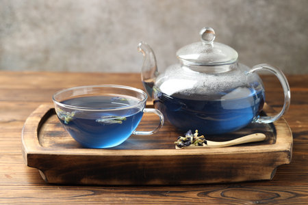Delicious butterfly pea flower tea on wooden tableの写真素材