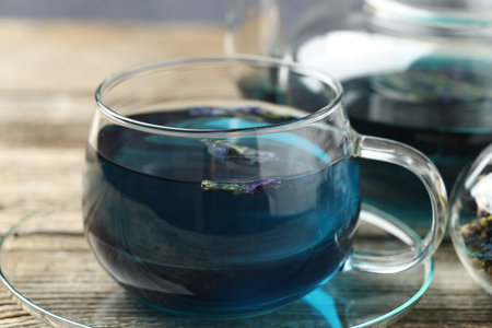 Delicious butterfly pea flower tea on wooden table, closeupの写真素材