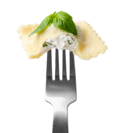Delicious ravioli with cheese and basil on fork against white backgroundの写真素材