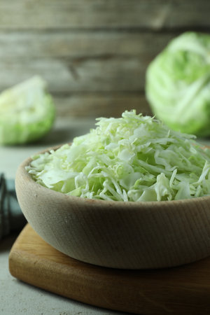 Fresh shredded cabbage on light table, closeupの写真素材