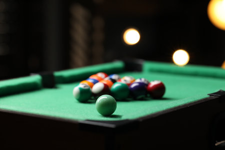 Billiard balls in triangle on green table indoors, closeup. Space for textの写真素材