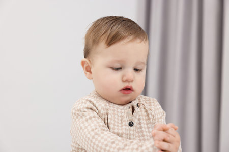 Portrait of sweet little baby at home