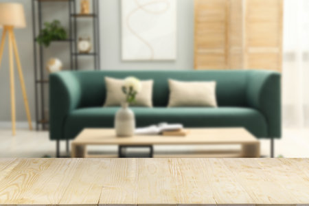 Empty wooden table in beautiful living room. Space for designの写真素材