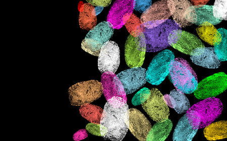Fingerprints of different colors on black background, space for textの写真素材