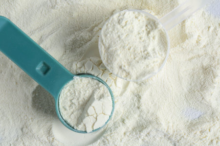 Pile of protein powder and scoops, top viewの写真素材