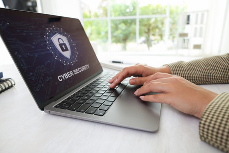 Cyber security. Woman using laptop at table, closeup
