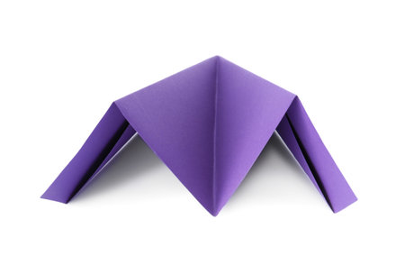 One handmade purple paper plane isolated on whiteの写真素材