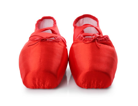 Pair of beautiful red pointe shoes isolated on whiteの写真素材