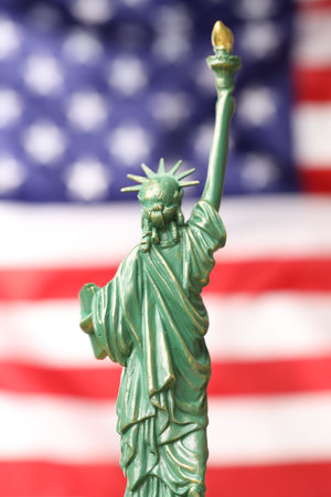 Statue of Liberty against flag of USA, closeupの写真素材