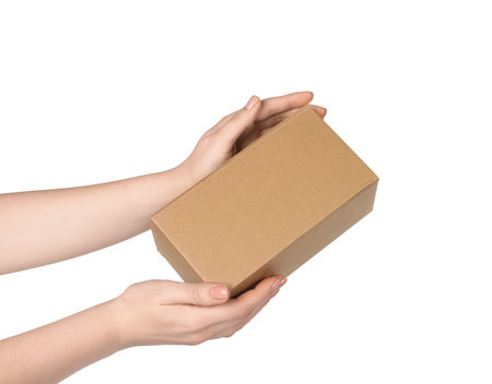 Woman with cardboard parcel box on white background, closeupの写真素材