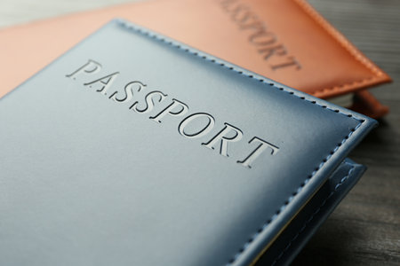 Passports in color covers on table, closeupの写真素材