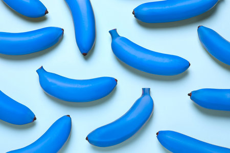 Blue bananas on light background, flat layの写真素材