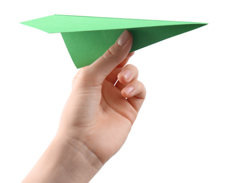 Woman with green paper plane on white background, closeupの写真素材