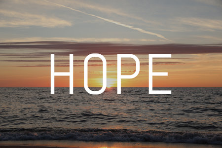 Hope. Picturesque view of sea and beach at sunriseの写真素材